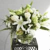 Breathtaking bowl vase of lilies, hydrangeas, orchids, roses.
