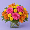 A vibrant and cheerful garden-style arrangement designed in a modern pink glass