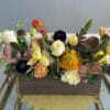 Mixed floral arrangement in a rectangular wooden box