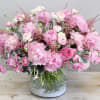 Peonies are the focal point of this arrangement! We've layered peonies with