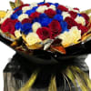 Bouquet of red, white, and blue roses wrapped in black and gold paper