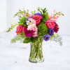 Designed by florists, this bouquet evokes comfort and charm through its bright