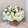 White rose bouquet in a decorative copper vase