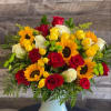 Bouquet of red, yellow, and white roses with sunflowers in a white vase