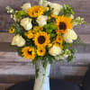 Sunflower and white rose bouquet in a tall vase