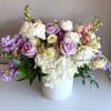 A serene blend of soft lavender and creamy white blooms in a