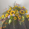 Large floral spray with sunflowers and purple blooms