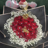 Red rose bouquet with white baby's breath and butterfly accents