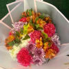 Flowers mix with pink wrapping paper does not includes a vase. Flowers