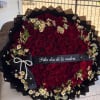 A dramatic, romantic bouquet of deep red roses mingled with delicate white