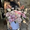 Overflowing with real and natural preserved roses, hydrangeas, ranunculus, carnations and airy