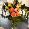 Pretty Pick-Me-Up is a cheerful burst of fresh blooms designed to brighten