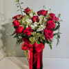 A bold cluster of vivid red roses makes an immediate impression in