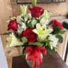 This lovely half dozen arrangement will get you XOXO's!