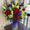 Uplifting variety of Spray Roses and mixed flowers.