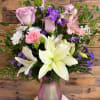 pink vase, filled with roses, lilies, filler, alstroemeria, stock