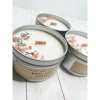 Three white sage and lavender tin candles with wood wicks and crystal and herb toppings