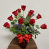 12 long stem red roses designed with lush green in red glass