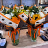 Wrapped bouquets for graduation. These arrangements will be made with a mix
