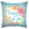 Square teal pillow with flowers and the words 