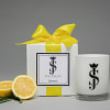 Lemon-scented candle gift set with a white box and glass candle