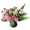Pink and peach roses with ranunculus in a green vase