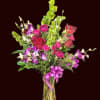 Wow them with beautiful dendrobium orchids and bells of Ireland accented with