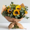 Spread love with this stunning sunflower wrapped bouquet.