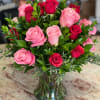 Bouquet of pink and red roses in a clear glass vase