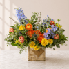 Colorful mixed flower arrangement in a rustic wooden box