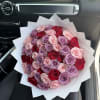 This unique and playful bouquet features two-toned roses surrounded by a mix