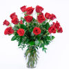 Tall bouquet of long-stemmed red roses in a clear glass vase