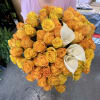 A lush, rounded bouquet of golden roses and white calla lilies-perfect as