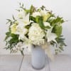 White vase with an all white design in a tall and beautiful