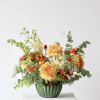 Meet &ldquo;Spring Oasis,&rdquo; a vibrant floral arrangement blending gold, fiery orange, and