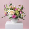 This love story is soft peach, pink and white garden inspired featuring