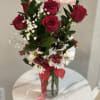 Classic red rose flower arrangement with daisies and fresh greenery available for