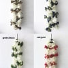 Four white floral leis with ribbon bows in different color combinations