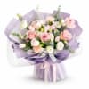 Soft pink and white roses and tulips mingle with ruffled carnations and