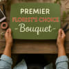 Hands holding a sign that reads Premier Florist's Choice Bouquet