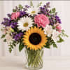 A bright sunflower takes center stage in this mixed-color appreciation bouquet, the