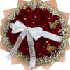 A dense dome of deep red roses makes an immediate statement-perfect as