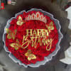Red rose bouquet with a birthday sign, crown, and gold butterfly accents