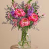 A vibrant burst of saturated pigment, this arrangement puts the spotlight on