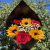 Bouquet of red roses and yellow sunflowers wrapped in black paper