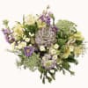 Mixed bouquet with pale lilies, purple flowers, and a succulent