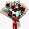 Bouquet of red roses and white flowers wrapped in beige paper