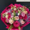 A custom-wrapped bouquet featuring two stunning shades of pink roses &mdash; soft