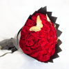 Bouquet of red roses wrapped in black paper with butterfly accents
