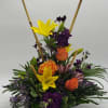 Upright bouquet with yellow lilies, orange roses, and purple flowers